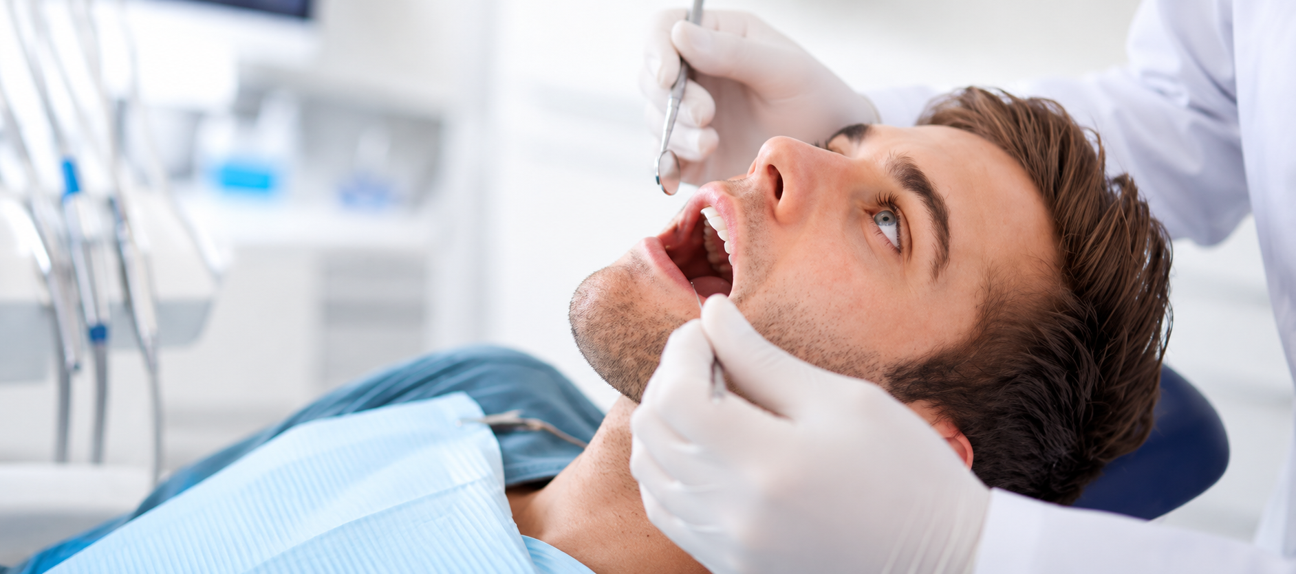 A dental professional discussing a tooth shade with a patient