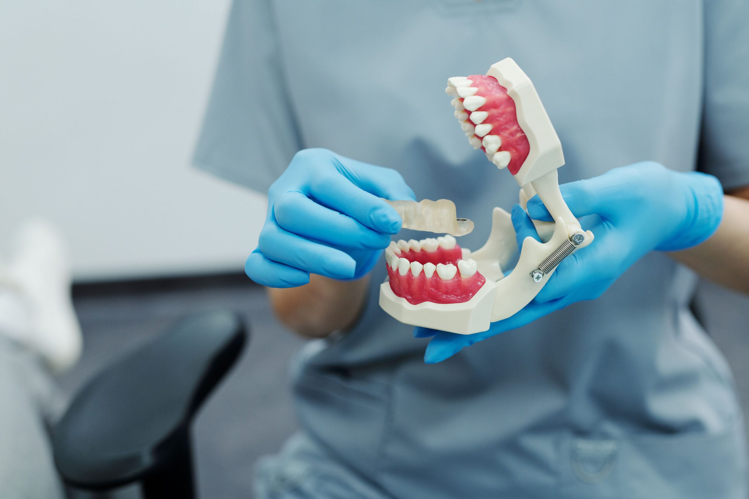 A dental professional discussing a tooth shade with a patient