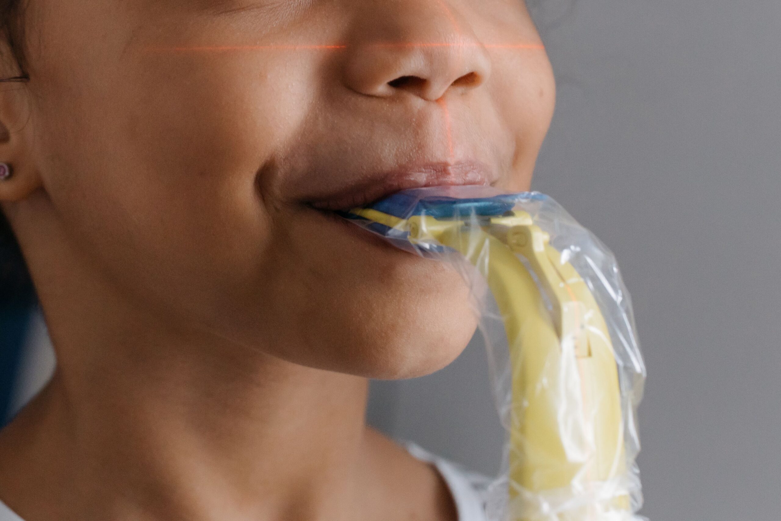 A dental professional discussing a tooth shade with a patient