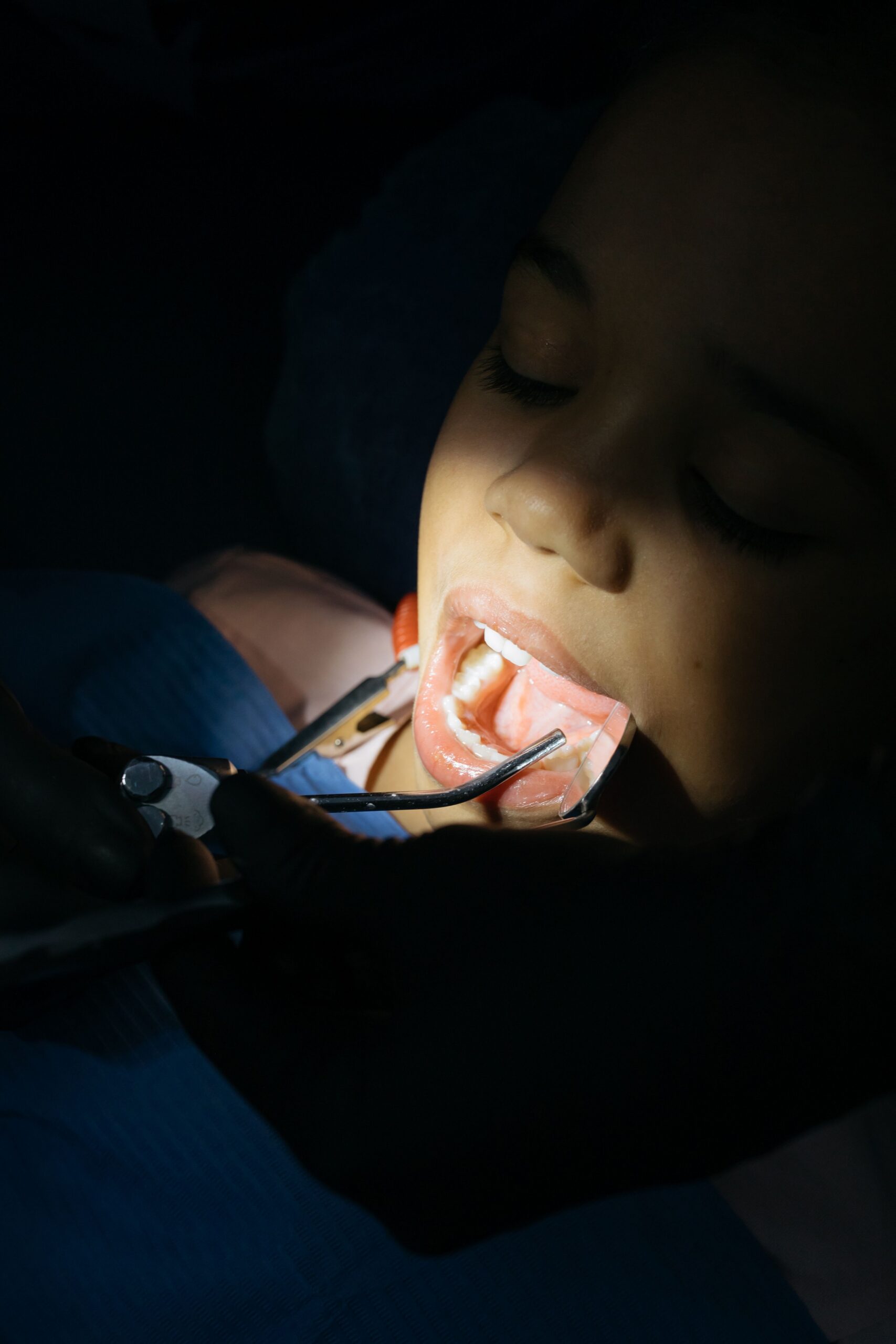 A dental professional discussing a tooth shade with a patient