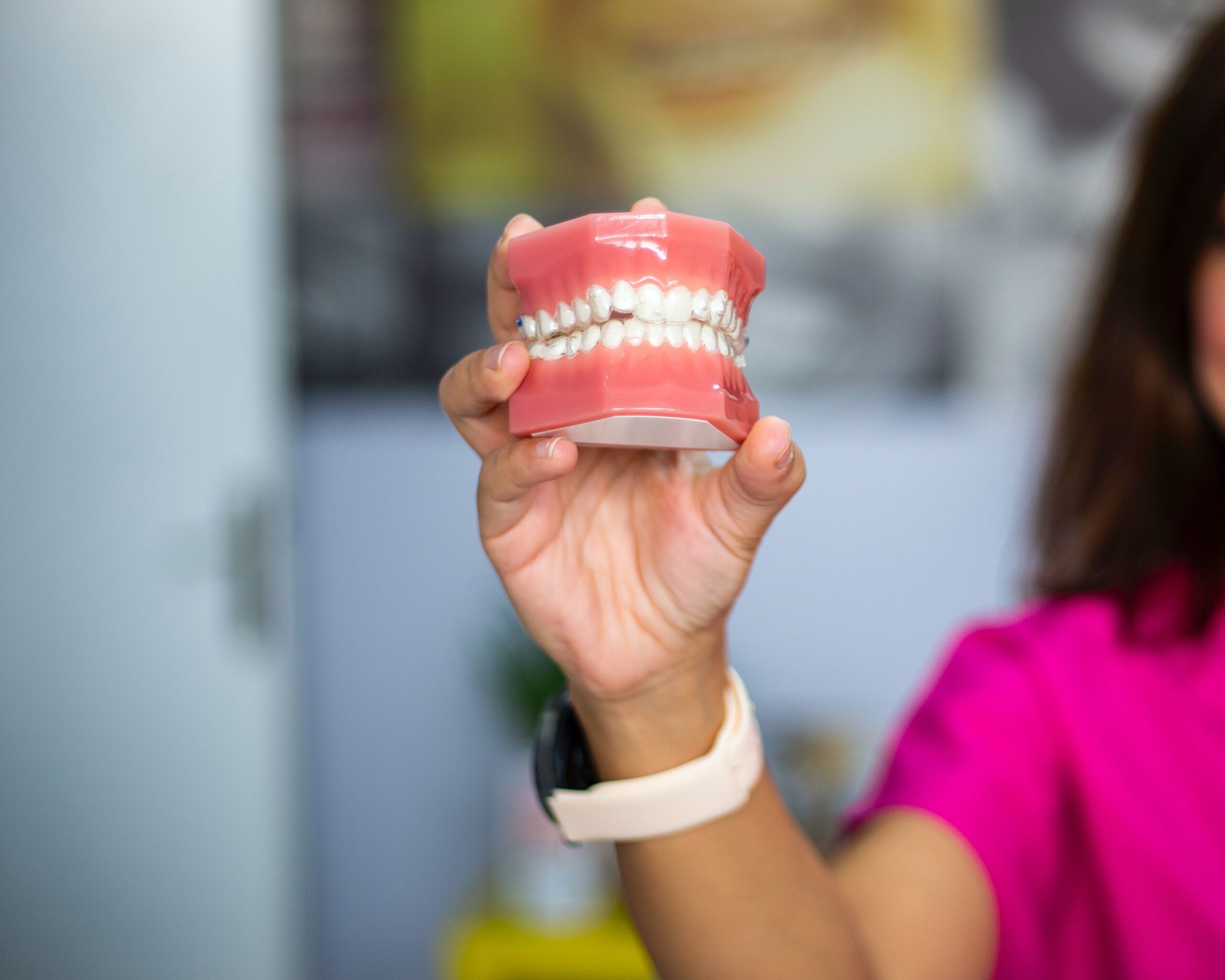A dental professional discussing a tooth shade with a patient
