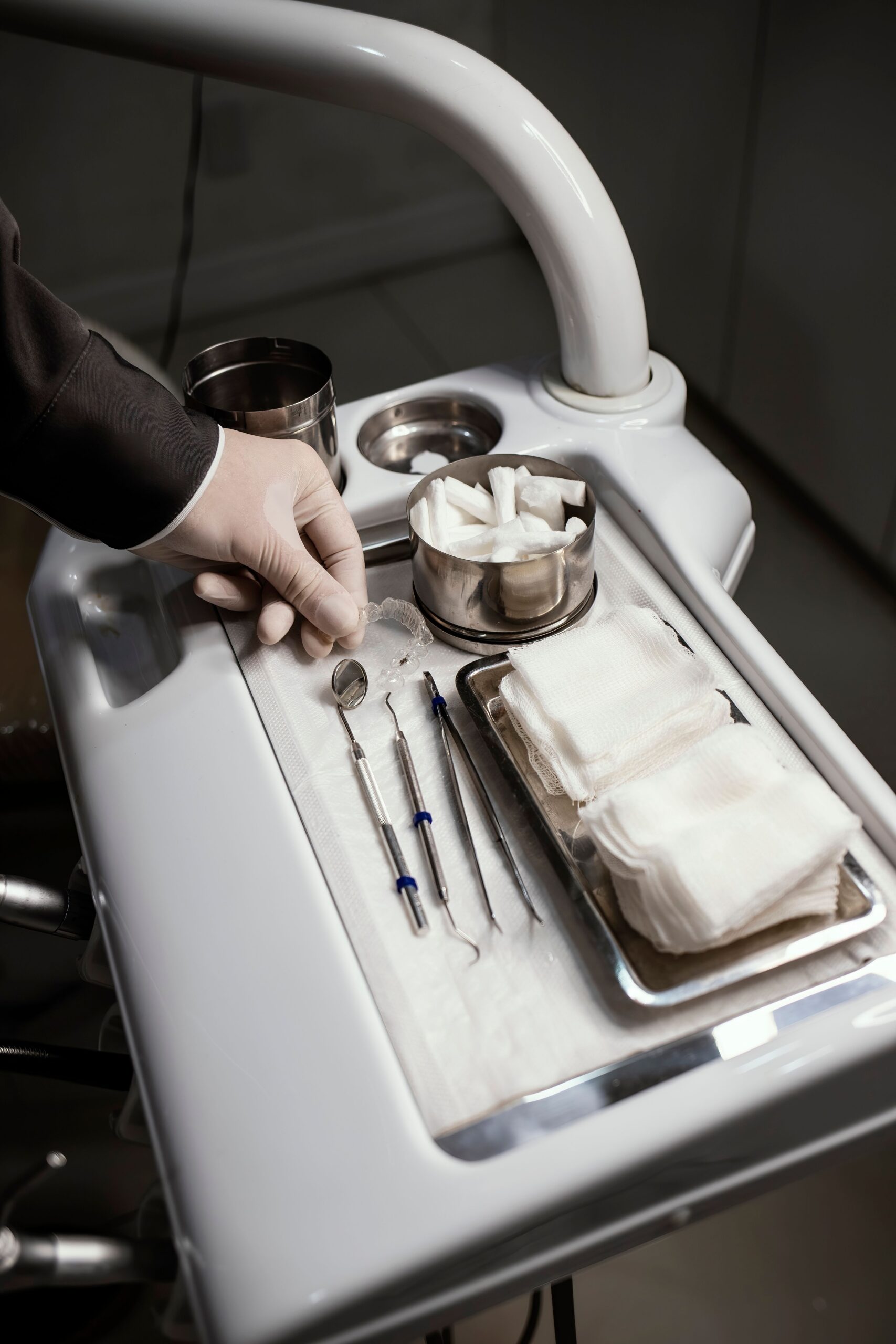 A dentist explaining an implant and crown to a patient