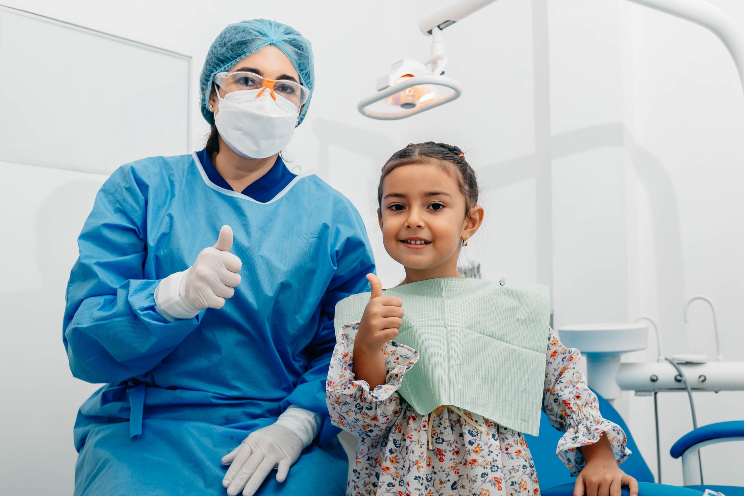 A dental professional discussing a tooth shade with a patient