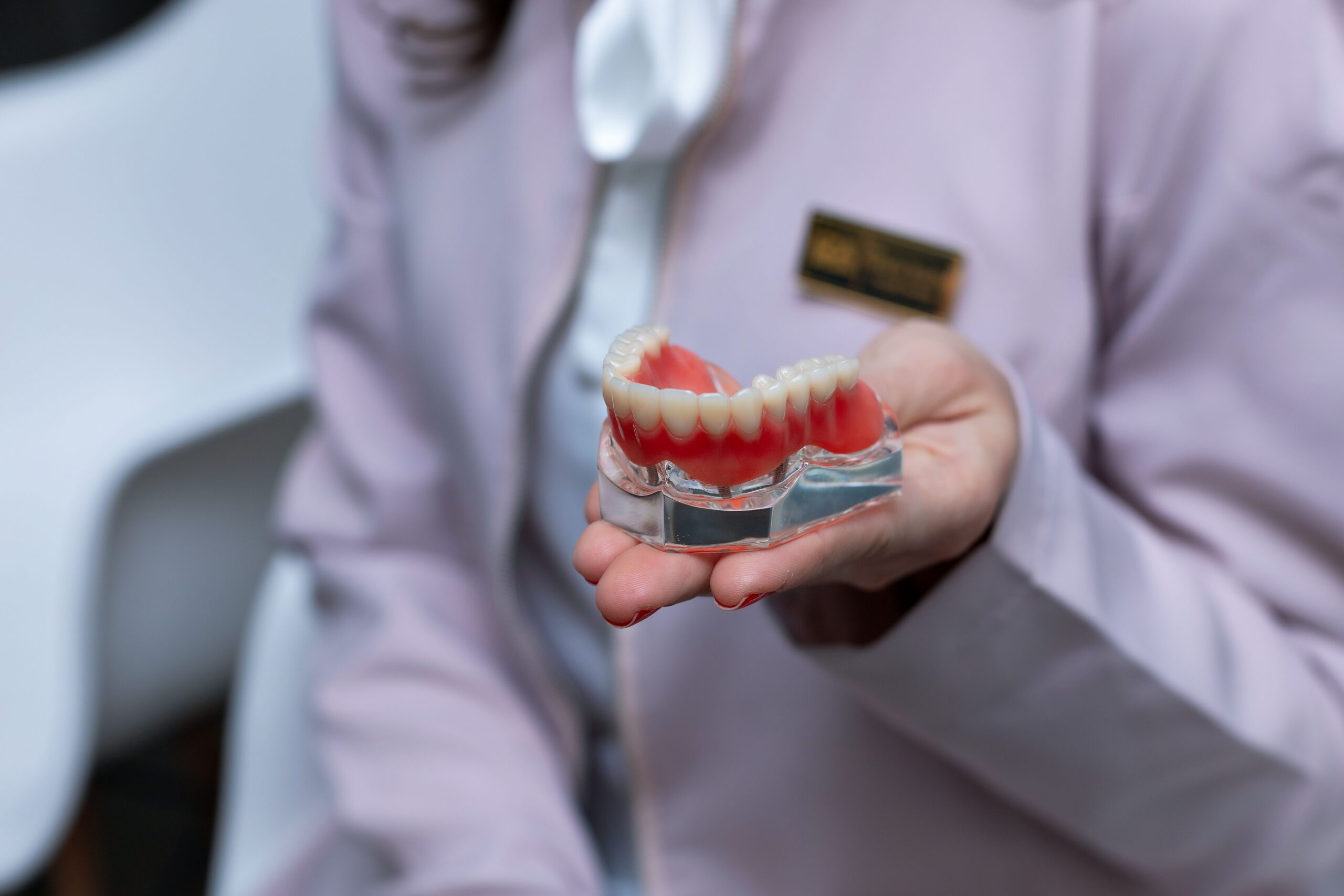 A dental professional discussing a tooth shade with a patient