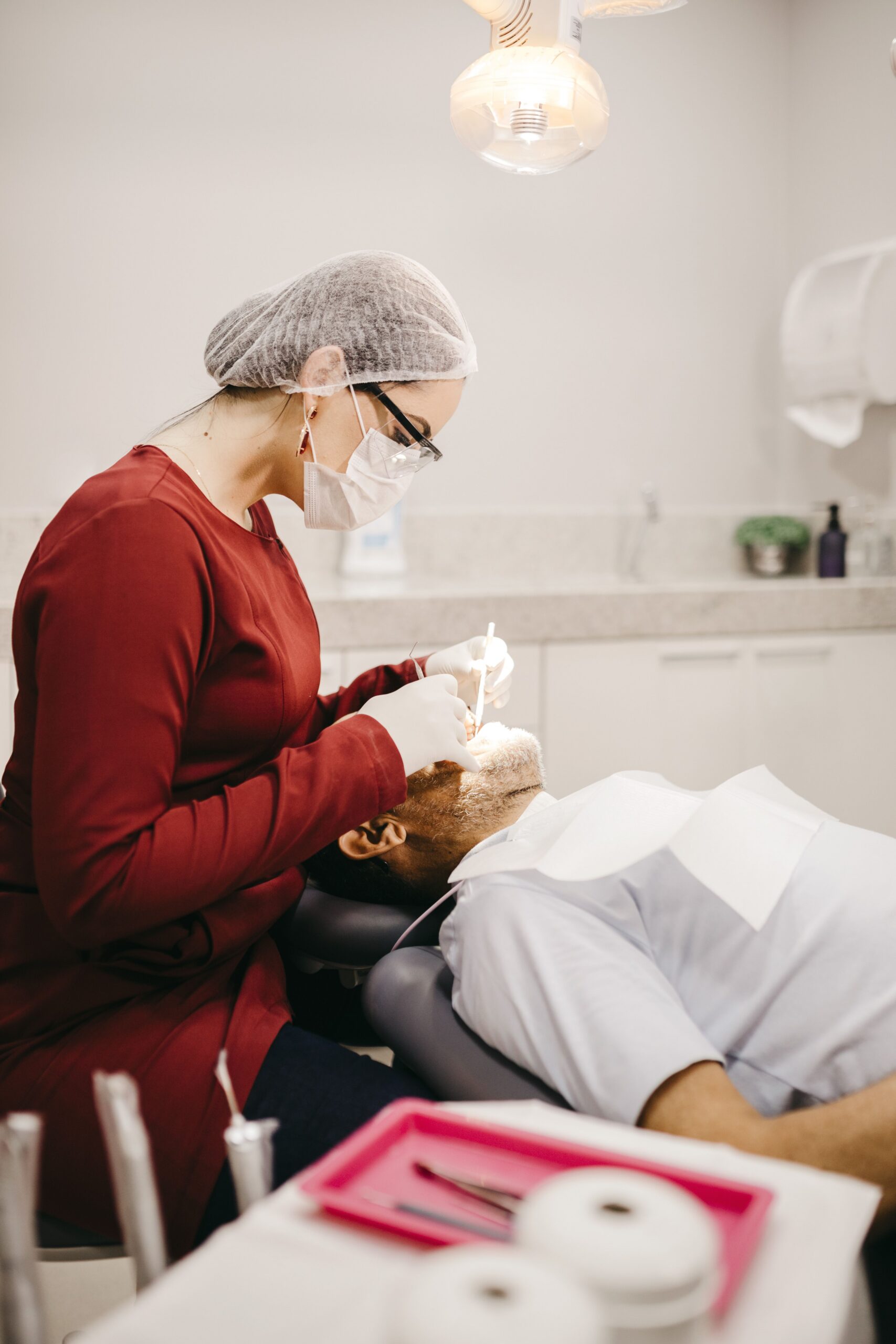 A dental professional discussing a tooth shade with a patient