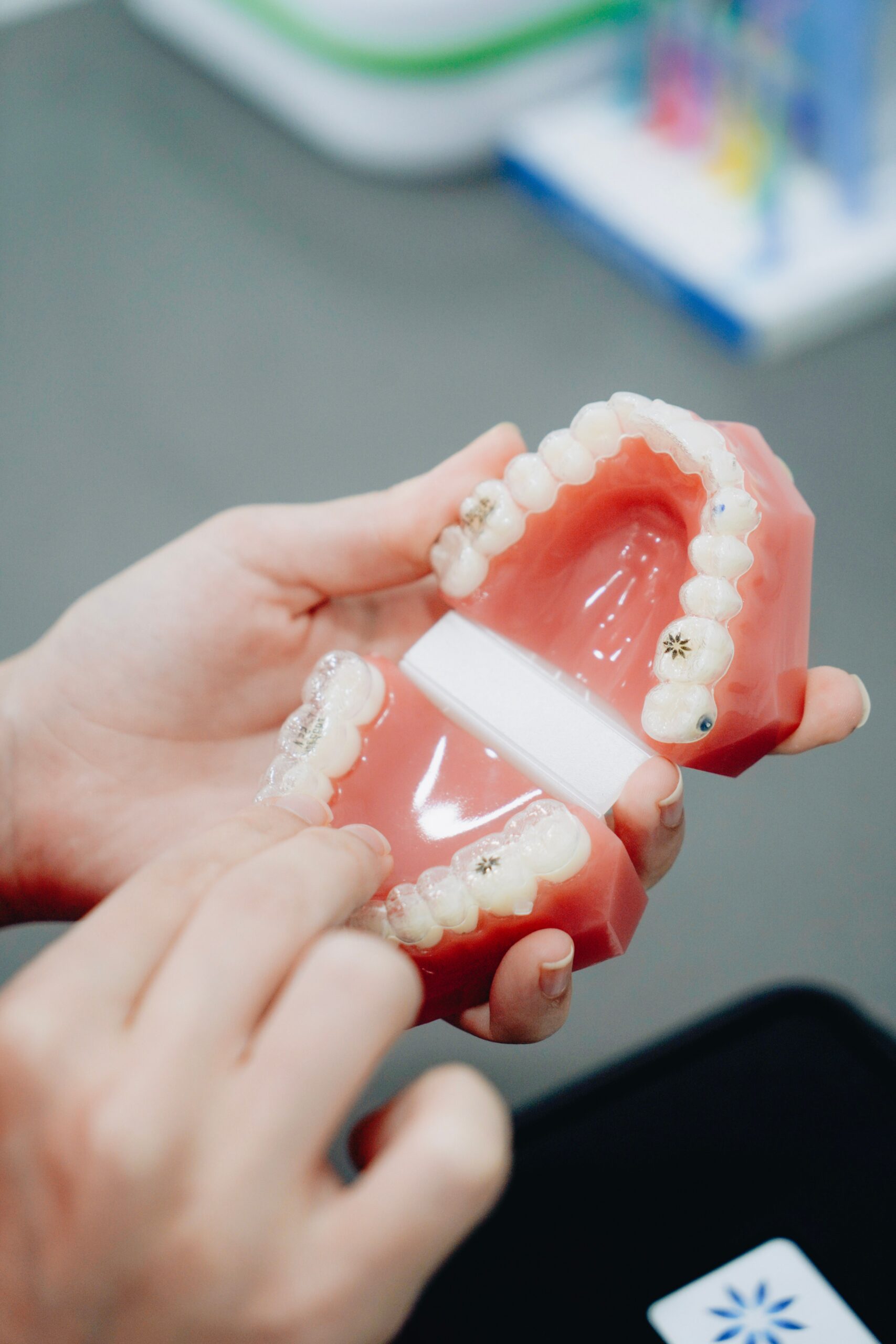 A dental professional discussing a tooth shade with a patient