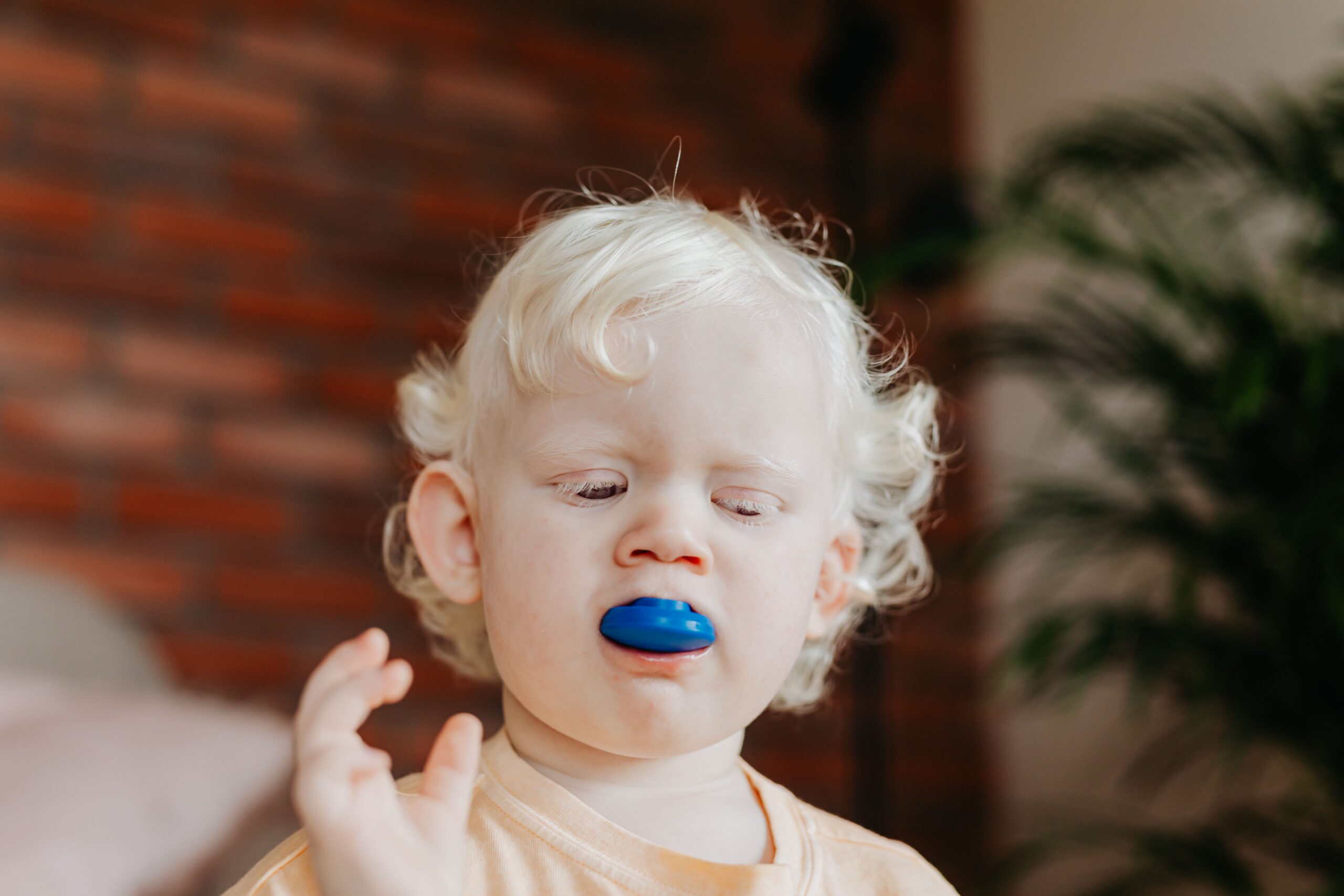 A dental professional discussing a tooth shade with a patient