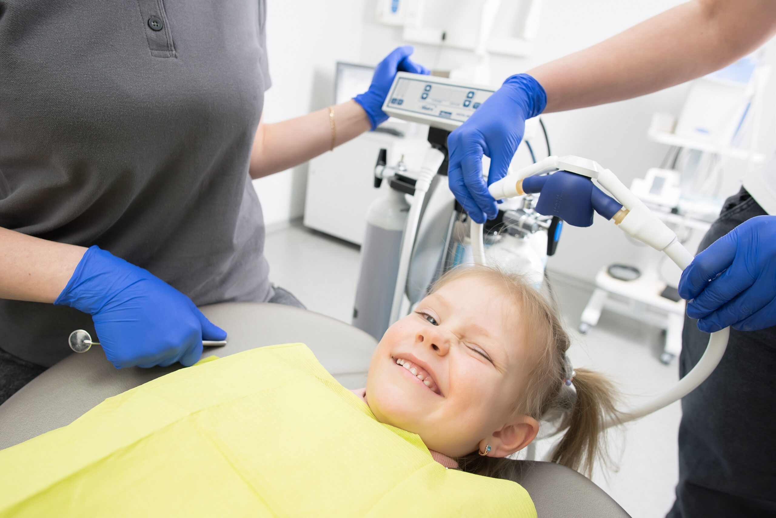 A young patient learning about dental care