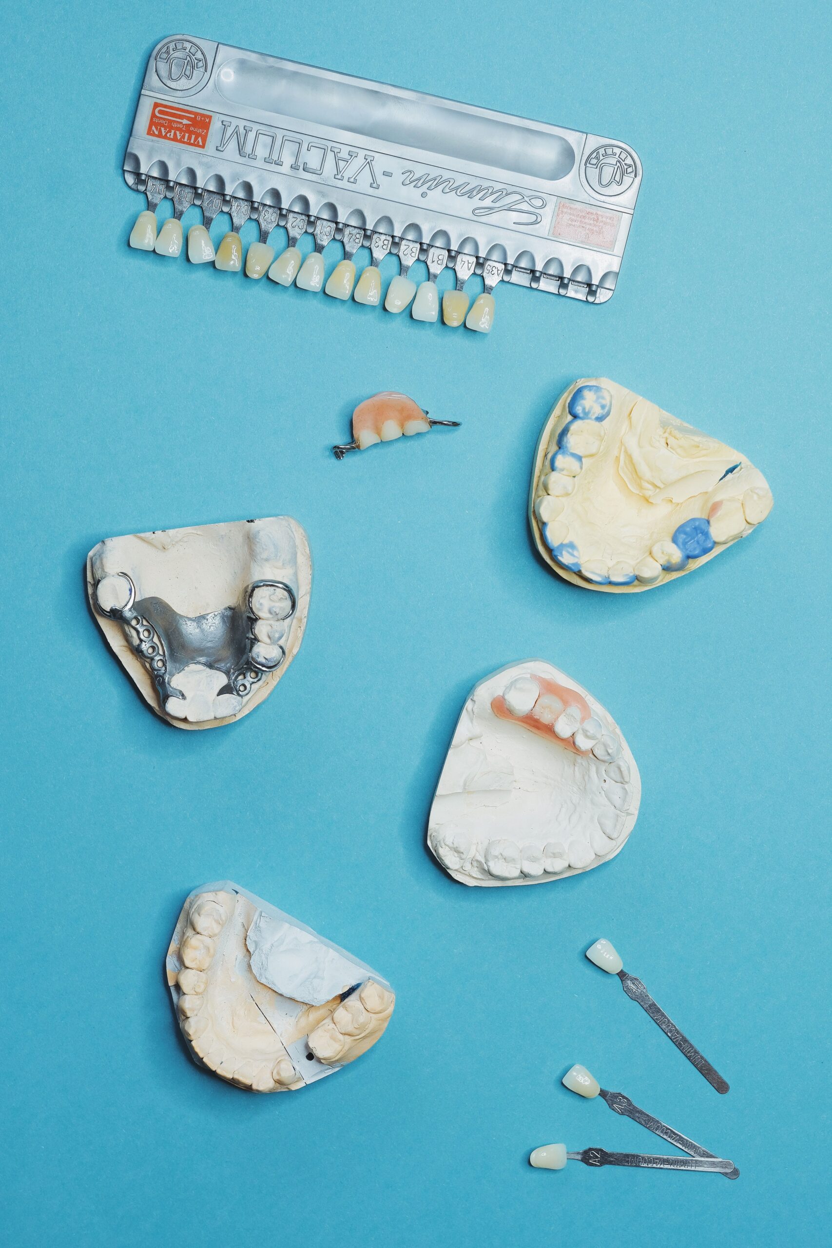 A dentist explaining an implant and crown to a patient