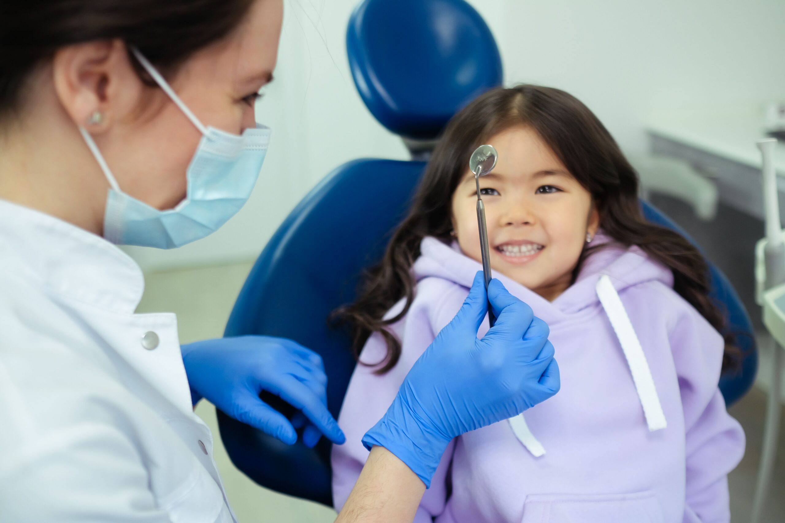 A young patient learning about dental care