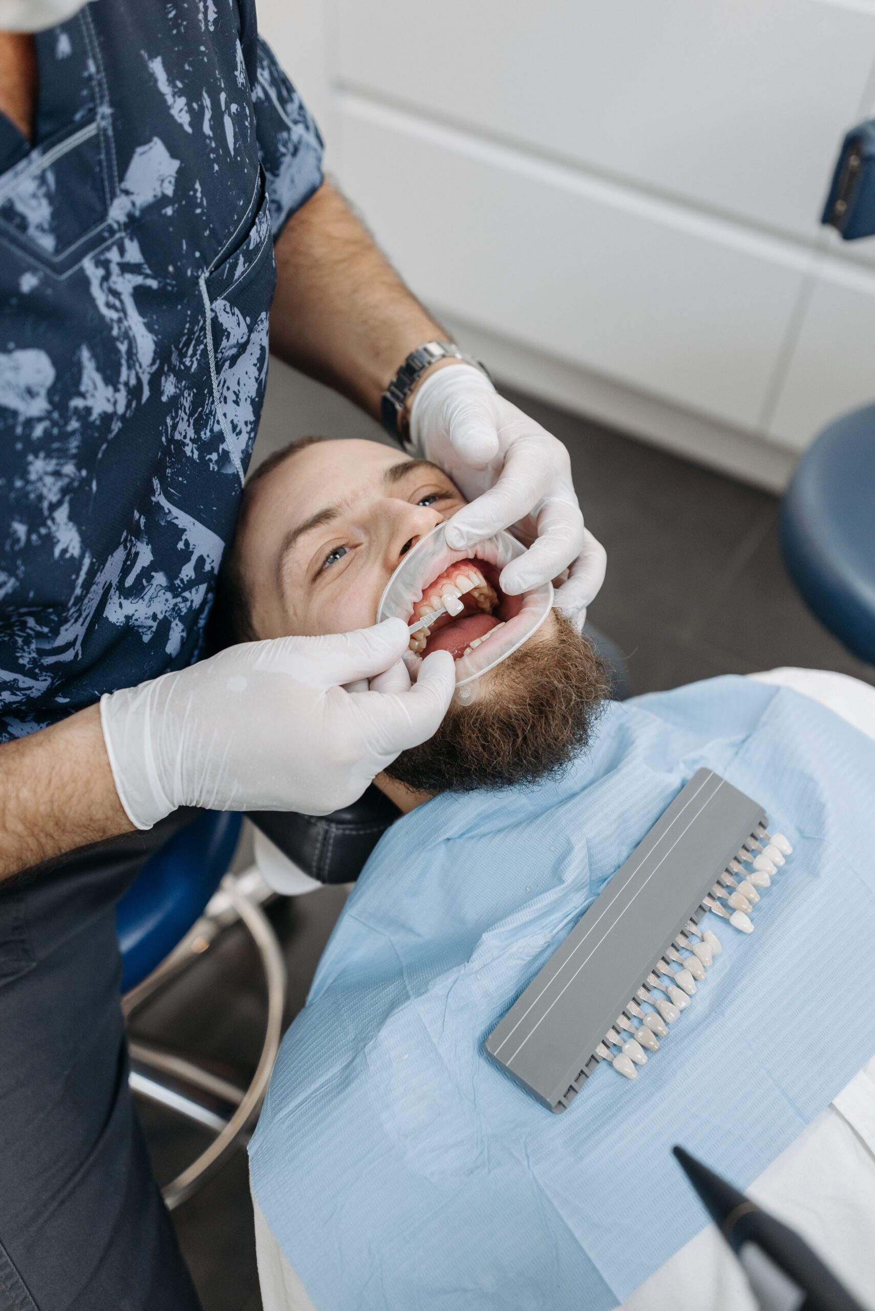 A patient discussing a tooth concern with a dentist