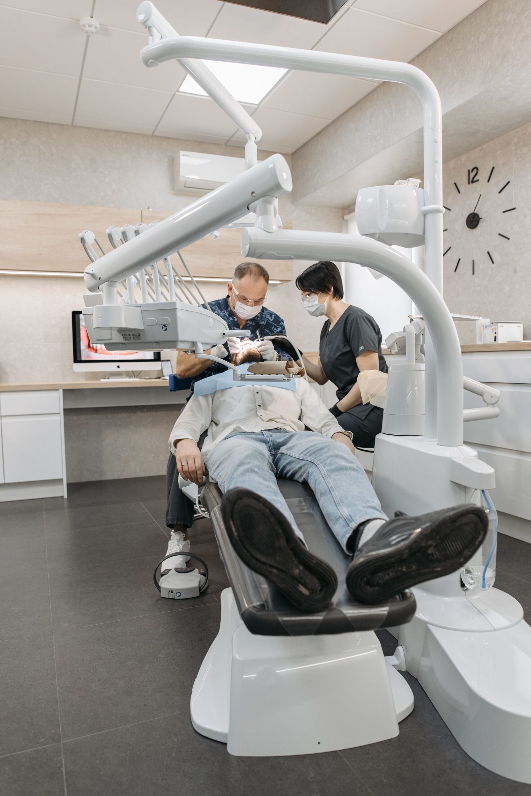 A dental professional discussing a tooth shade with a patient
