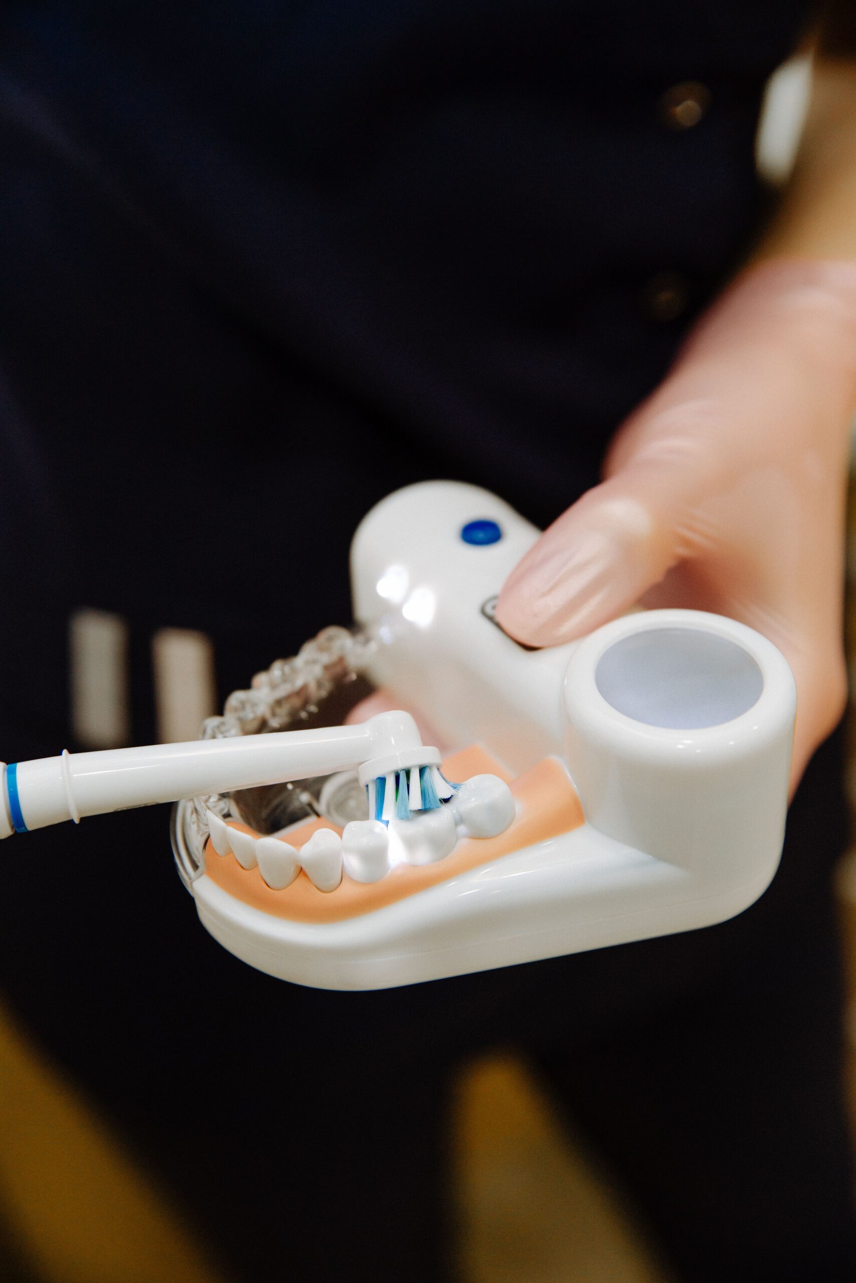 A dental professional discussing a tooth shade with a patient
