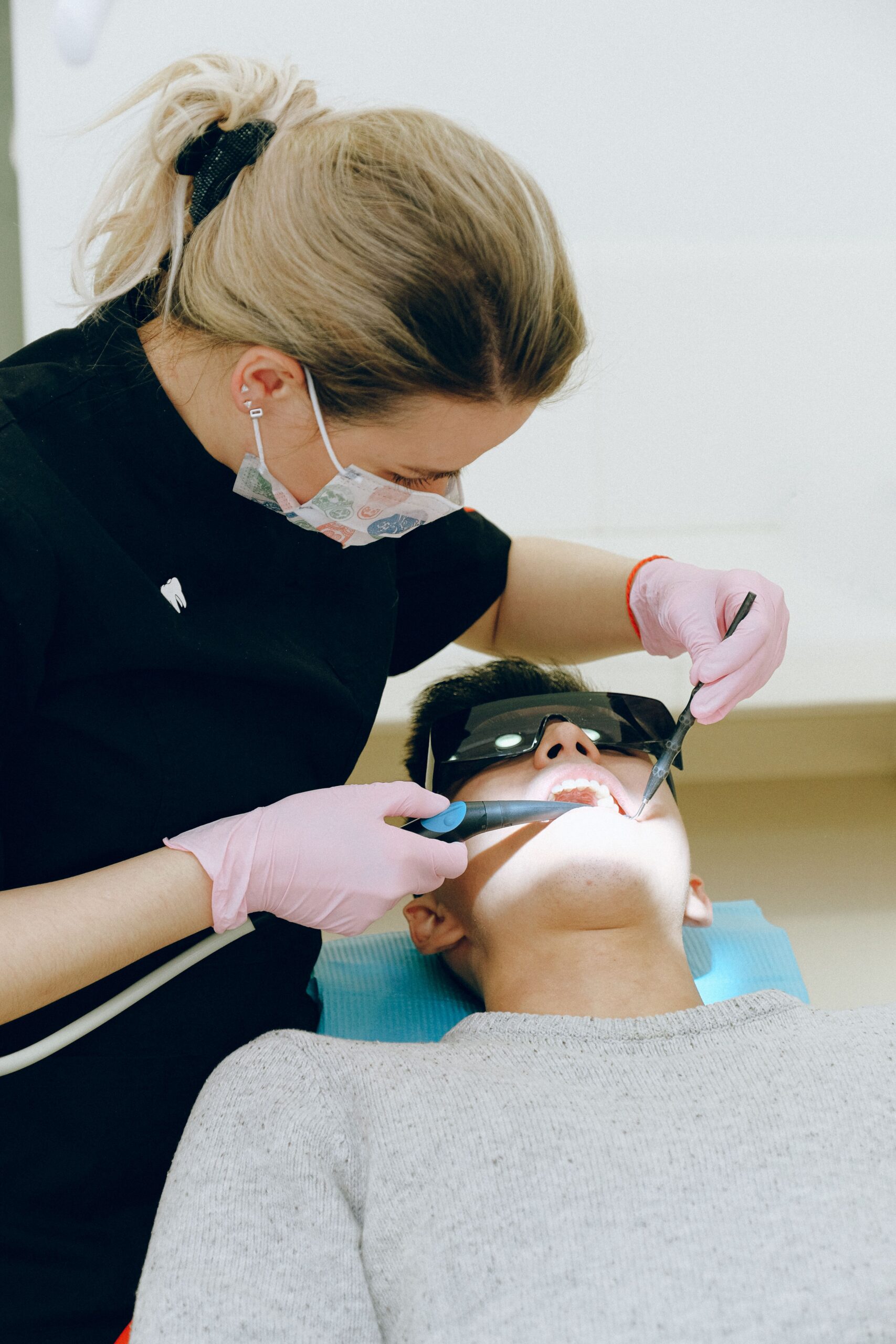 A dental professional discussing a tooth shade with a patient