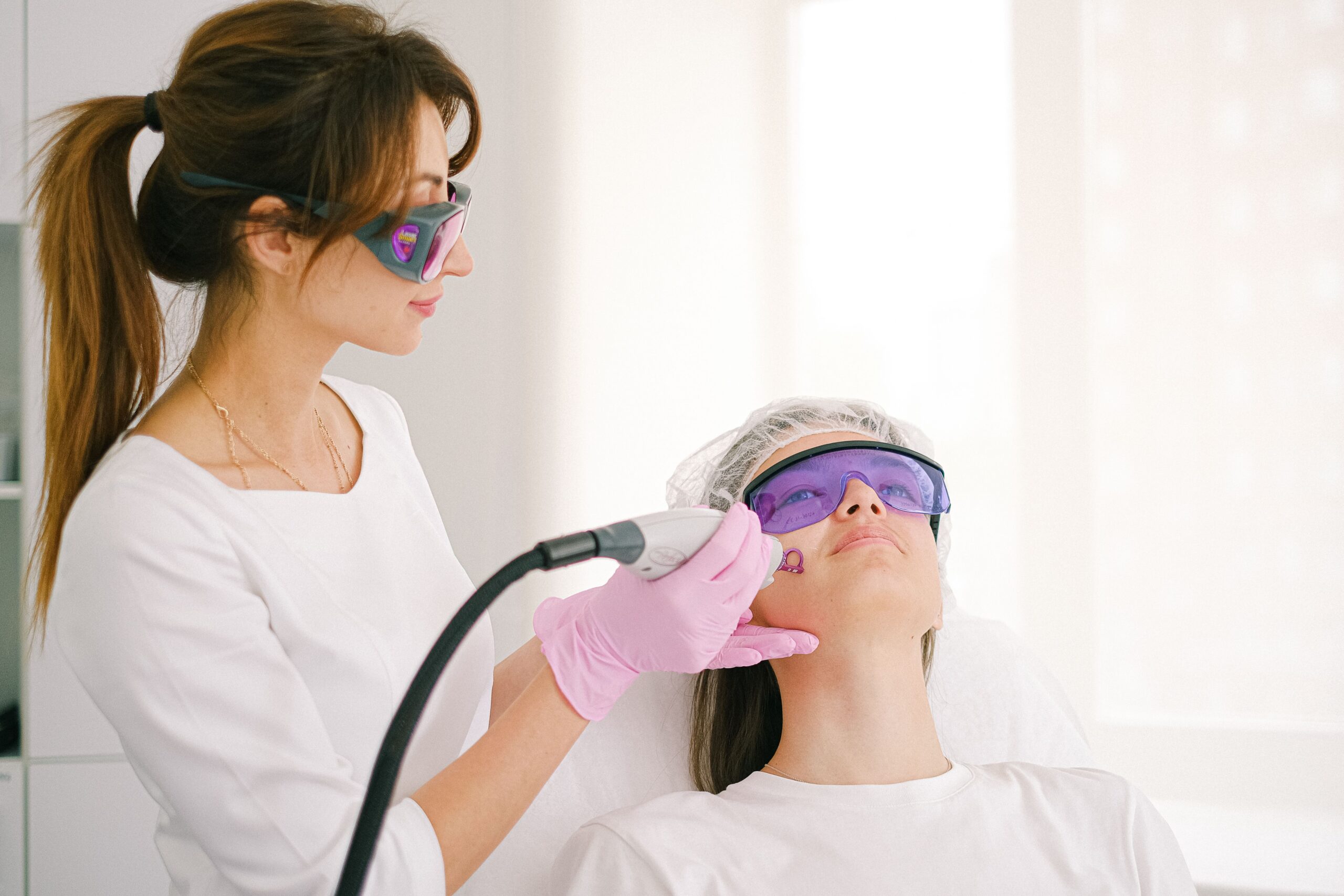 A smiling patient sharing a high five with a dental professional
