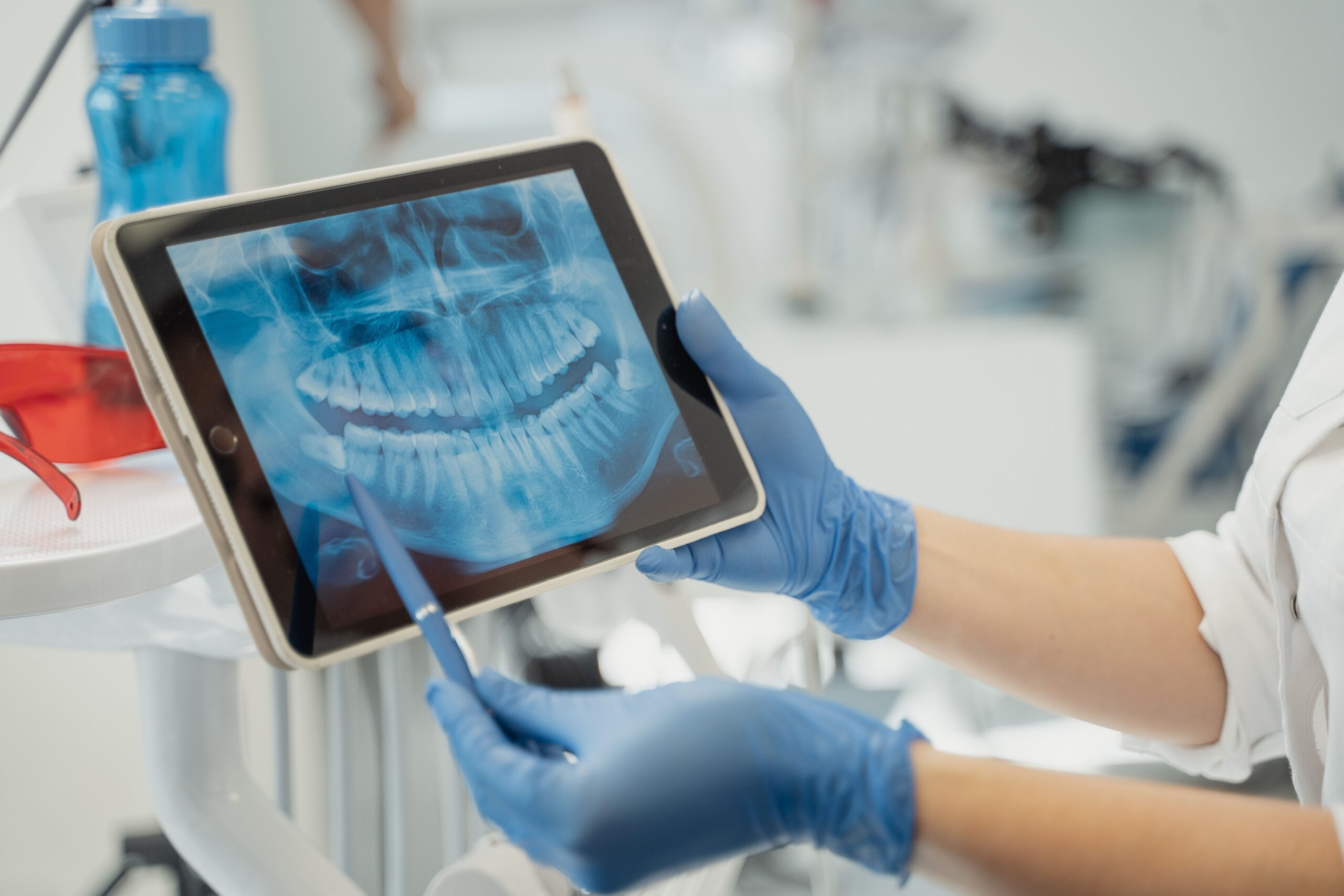 A dental professional discussing a tooth shade with a patient